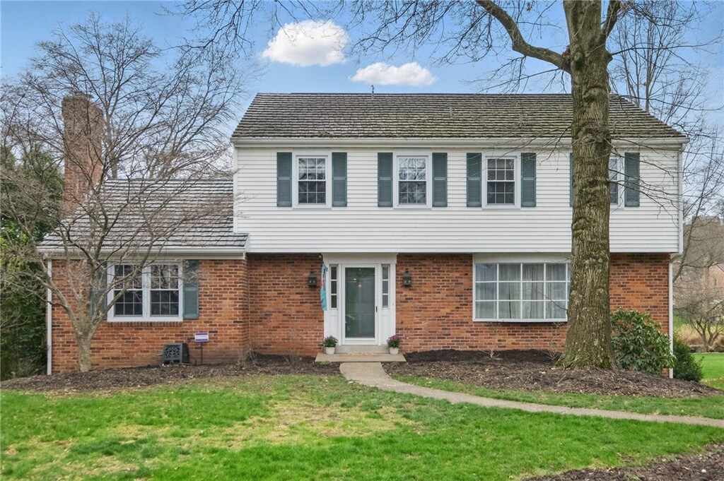 8092 Dormar Ct, Mccandless, PA 15237 - colonial home featuring brick siding, a front lawn, and a chimney