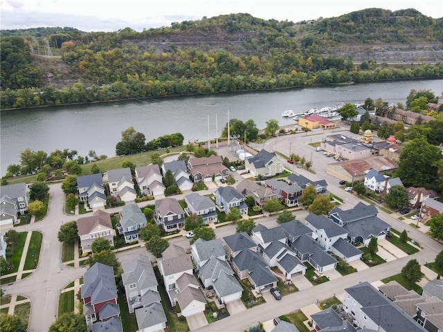 birds eye view of property featuring a water view and a residential view