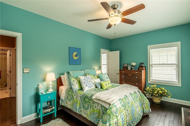 bedroom featuring dark wood-type flooring, baseboards, and a ceiling fan