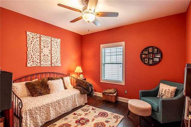 bedroom featuring hardwood / wood-style floors, ceiling fan, and baseboards