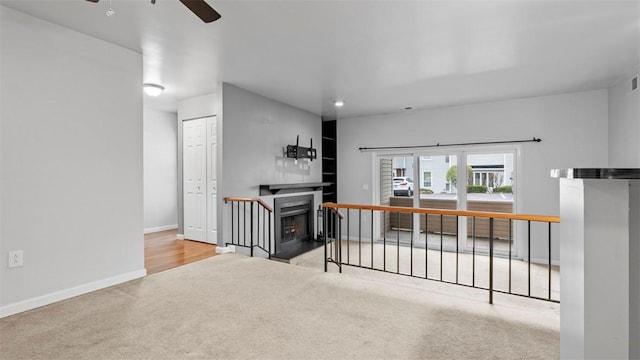 1814 Kenzie Dr, Robinson Twp Nwa, PA 15205 - interior space featuring visible vents, baseboards, ceiling fan, a fireplace with flush hearth, and carpet flooring