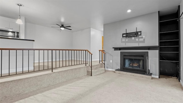 1814 Kenzie Dr, Robinson Twp Nwa, PA 15205 - unfurnished living room featuring ceiling fan, a fireplace with raised hearth, recessed lighting, carpet flooring, and baseboards