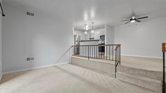1814 Kenzie Dr, Robinson Twp Nwa, PA 15205 - unfurnished living room with visible vents, baseboards, a ceiling fan, and light colored carpet