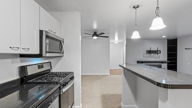 1814 Kenzie Dr, Robinson Twp Nwa, PA 15205 - kitchen featuring a ceiling fan, baseboards, white cabinetry, and stainless steel appliances
