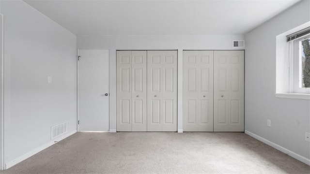 1814 Kenzie Dr, Robinson Twp Nwa, PA 15205 - unfurnished bedroom with visible vents, carpet flooring, and two closets