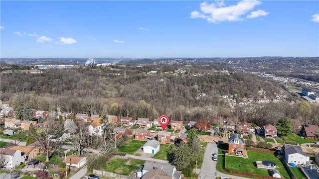bird's eye view featuring a view of trees and a residential view