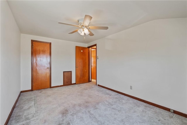 unfurnished bedroom with carpet flooring, baseboards, and a ceiling fan