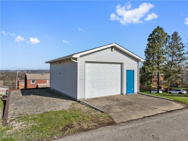 detached garage featuring driveway