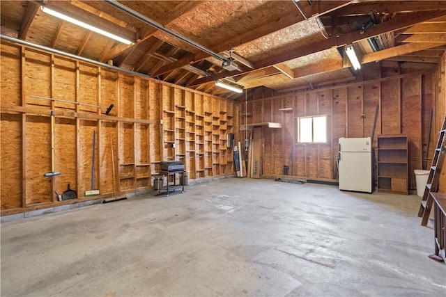 garage with freestanding refrigerator