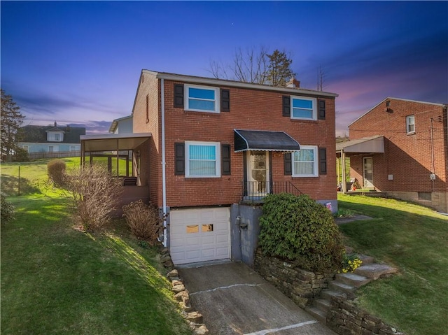 view of front of house with brick siding, driveway, a garage, and a front lawn