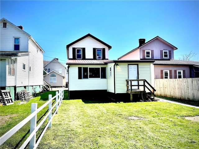 105 Ludwig St, Manorville Boro, PA 16236 - view of front facade with fence and a front lawn