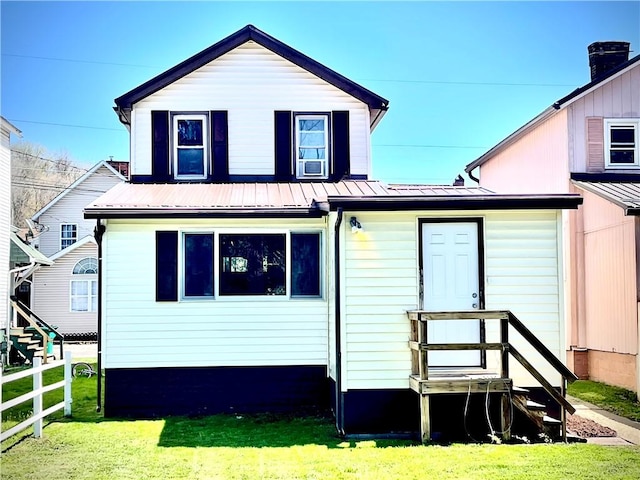 105 Ludwig St, Manorville Boro, PA 16236 - rear view of property with metal roof, fence, and a lawn