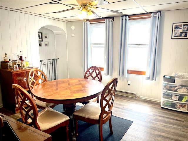 105 Ludwig St, Manorville Boro, PA 16236 - dining area with arched walkways, wood finished floors, ceiling fan, and a decorative wall