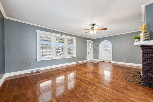 1634 Mcminn, Aliquippa, PA 15001 - unfurnished living room featuring ceiling fan, arched walkways, visible vents, a healthy amount of sunlight, and wood-type flooring