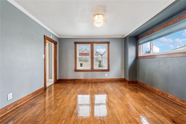 1634 Mcminn, Aliquippa, PA 15001 - empty room featuring crown molding, wood finished floors, baseboards, and plenty of natural light