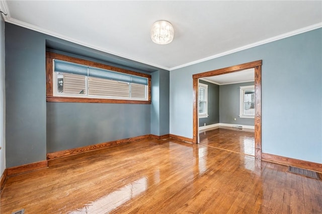 1634 Mcminn, Aliquippa, PA 15001 - unfurnished room with baseboards, hardwood / wood-style floors, crown molding, and visible vents