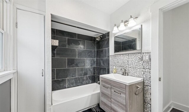 1634 Mcminn, Aliquippa, PA 15001 - bathroom with washtub / shower combination, vanity, and backsplash