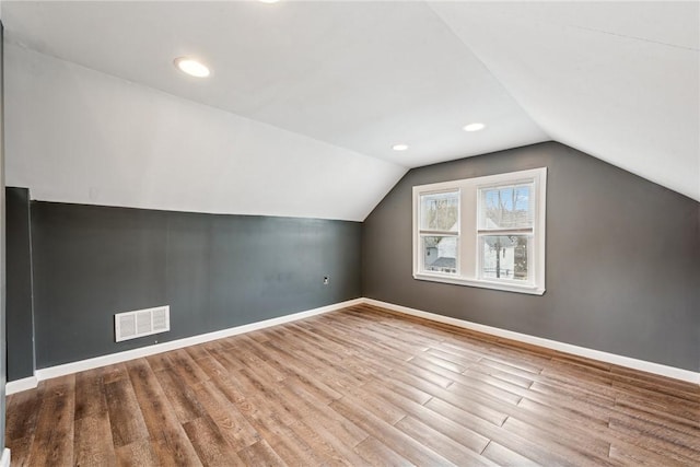 1634 Mcminn, Aliquippa, PA 15001 - bonus room with lofted ceiling, visible vents, baseboards, and wood finished floors