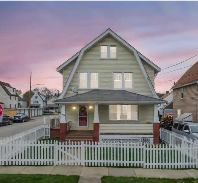 1634 Mcminn, Aliquippa, PA 15001 - colonial inspired home with roof with shingles, a porch, a gambrel roof, and a fenced front yard