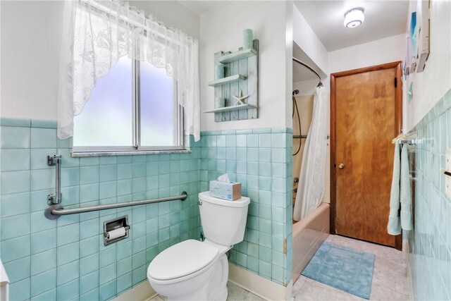 10110 Rinaman Rd, Mccandless, PA 15090 - bathroom featuring tile walls, shower / bath combo, tile patterned flooring, and wainscoting