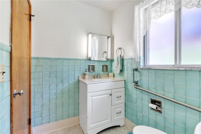 10110 Rinaman Rd, Mccandless, PA 15090 - bathroom with tile walls, vanity, tile patterned floors, and wainscoting