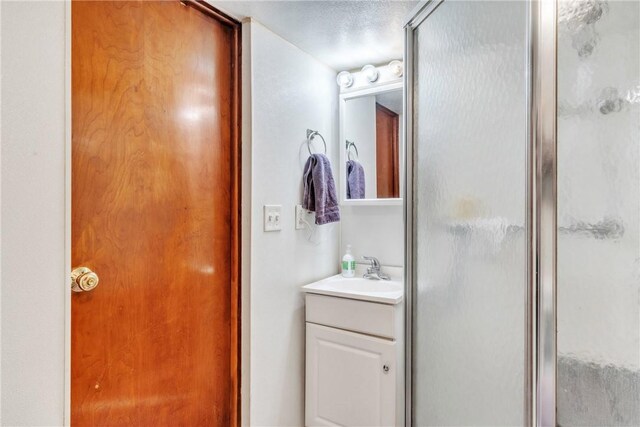 10110 Rinaman Rd, Mccandless, PA 15090 - full bath featuring a stall shower, vanity, and a textured ceiling