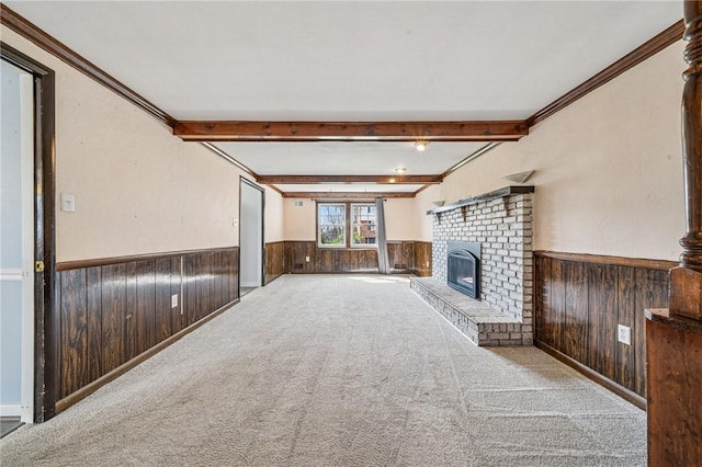 2096 Ramsey Rd, Monroeville, PA 15146 - unfurnished living room featuring carpet flooring, wooden walls, a wainscoted wall, a brick fireplace, and beam ceiling