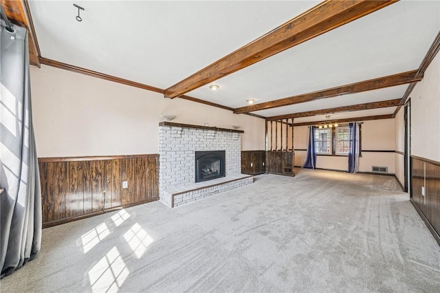 2096 Ramsey Rd, Monroeville, PA 15146 - unfurnished living room featuring wooden walls, wainscoting, and carpet