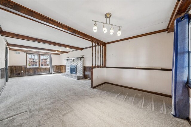 2096 Ramsey Rd, Monroeville, PA 15146 - unfurnished living room with a fireplace, wooden walls, wainscoting, beam ceiling, and carpet