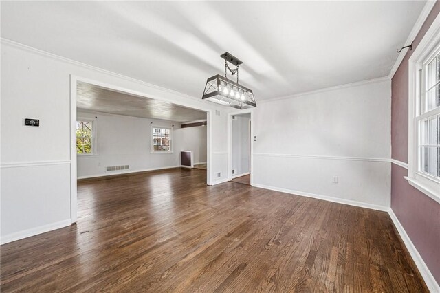 2096 Ramsey Rd, Monroeville, PA 15146 - unfurnished living room with ornamental molding, visible vents, baseboards, and wood finished floors