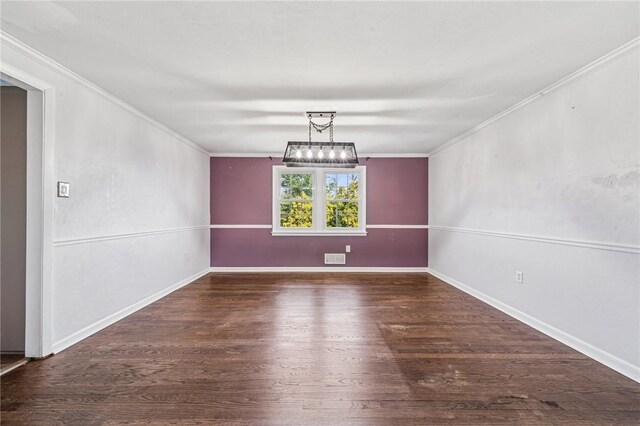 2096 Ramsey Rd, Monroeville, PA 15146 - unfurnished dining area with crown molding, baseboards, an inviting chandelier, and wood finished floors