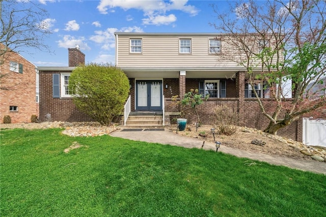 2096 Ramsey Rd, Monroeville, PA 15146 - view of front of property featuring a front yard, brick siding, french doors, and a chimney