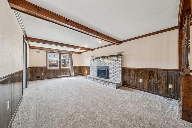 2096 Ramsey Rd, Monroeville, PA 15146 - unfurnished living room with wood walls, carpet flooring, a wainscoted wall, and beam ceiling
