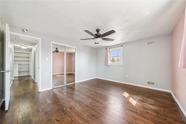 2096 Ramsey Rd, Monroeville, PA 15146 - unfurnished bedroom featuring dark wood-type flooring, a closet, visible vents, attic access, and baseboards