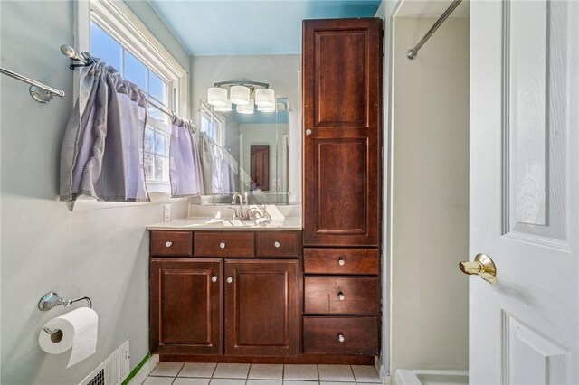 2096 Ramsey Rd, Monroeville, PA 15146 - bathroom featuring vanity, baseboards, tile patterned flooring, and visible vents