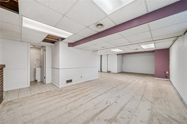 2096 Ramsey Rd, Monroeville, PA 15146 - finished below grade area featuring carpet flooring, visible vents, baseboards, and a paneled ceiling