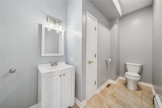 221 Pitgas Rd, Clarksville, PA 15322 - half bathroom with vanity, a baseboard heating unit, baseboards, and toilet
