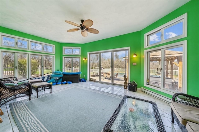 221 Pitgas Rd, Clarksville, PA 15322 - sunroom / solarium featuring ceiling fan, tile patterned flooring, a baseboard heating unit, and baseboards