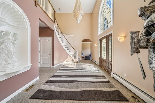 221 Pitgas Rd, Clarksville, PA 15322 - entryway featuring visible vents, baseboards, a notable chandelier, a baseboard radiator, and stairway