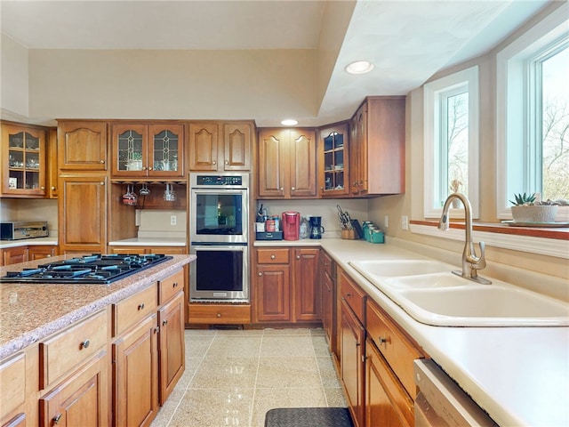 221 Pitgas Rd, Clarksville, PA 15322 - kitchen with recessed lighting, appliances with stainless steel finishes, light countertops, a sink, and brown cabinets