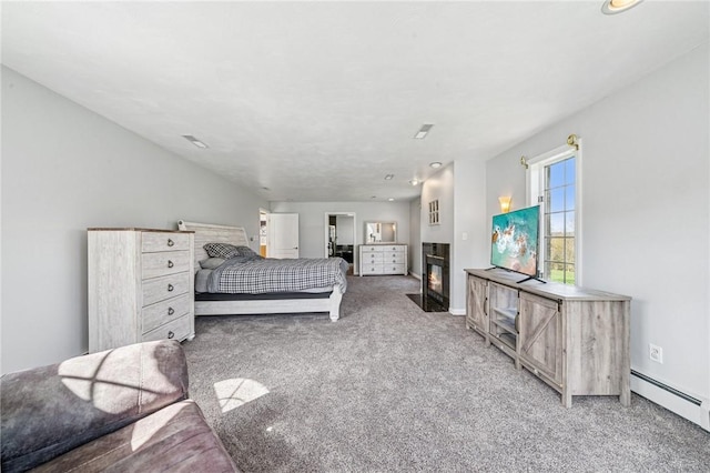 221 Pitgas Rd, Clarksville, PA 15322 - carpeted bedroom with a fireplace with flush hearth, a baseboard heating unit, baseboards, and visible vents