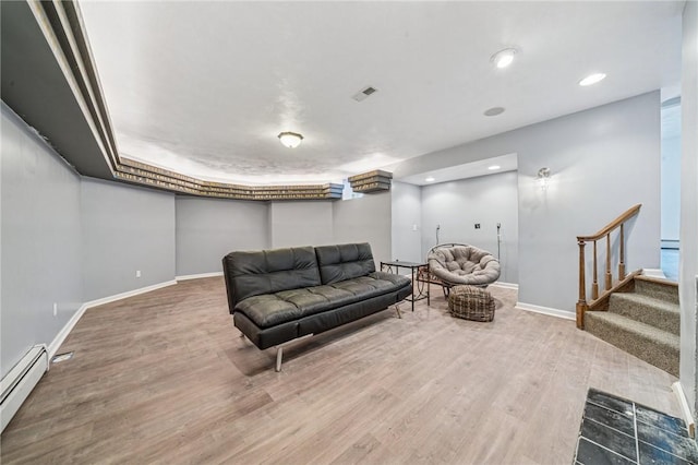 221 Pitgas Rd, Clarksville, PA 15322 - sitting room with visible vents, stairway, baseboard heating, wood finished floors, and baseboards