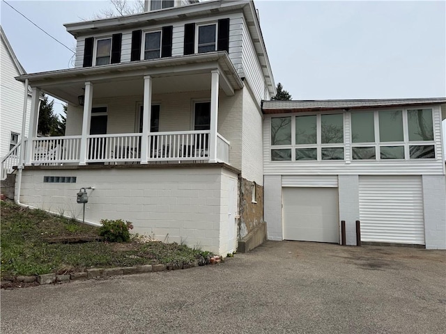 1419 Alverado Ave, Beechview, PA 15216 - view of front of property featuring driveway, an attached garage, and covered porch