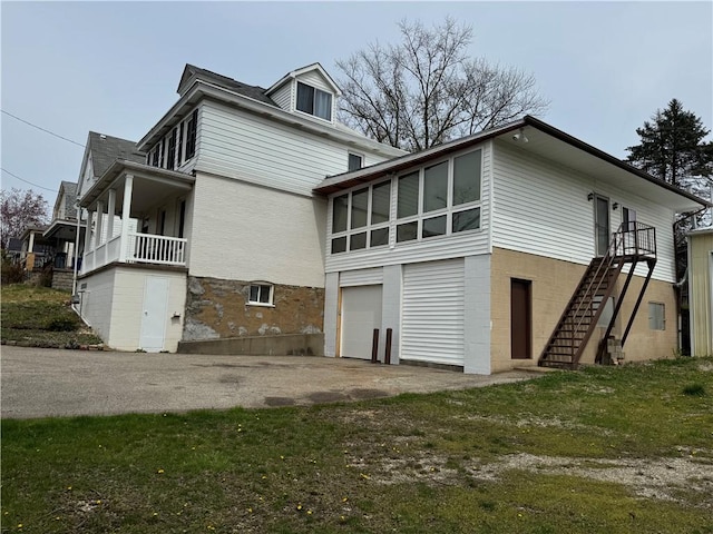 1419 Alverado Ave, Beechview, PA 15216 - view of side of property with a garage, aphalt driveway, and stairs
