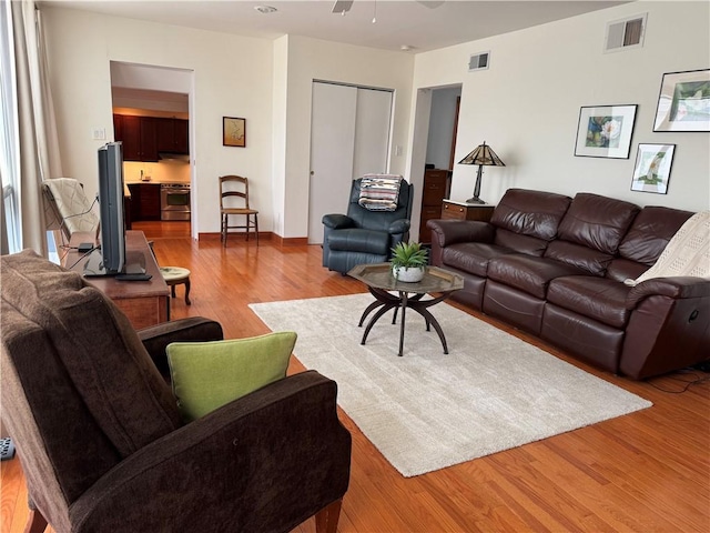 1419 Alverado Ave, Beechview, PA 15216 - living area with visible vents, a ceiling fan, and wood finished floors