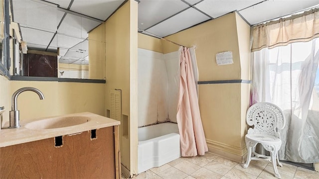 bathroom featuring vanity, tile patterned flooring, and shower / tub combo with curtain