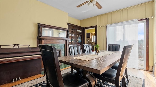 dining area featuring light wood-style floors and a ceiling fan