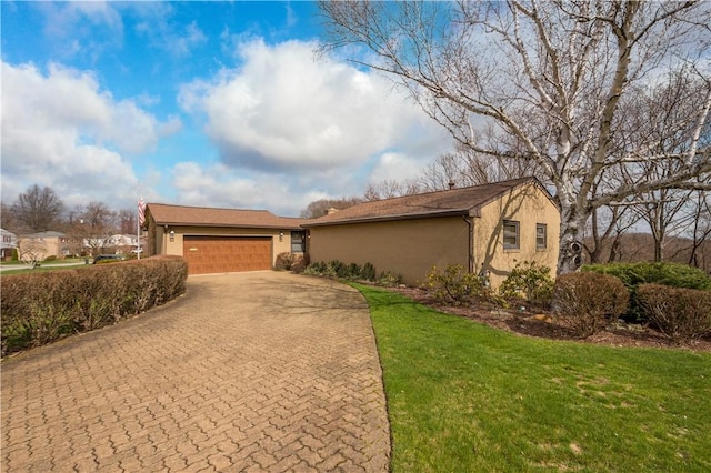 1805 Educational Dr, White Oak, PA 15131 - single story home with a garage, stucco siding, a front lawn, and decorative driveway