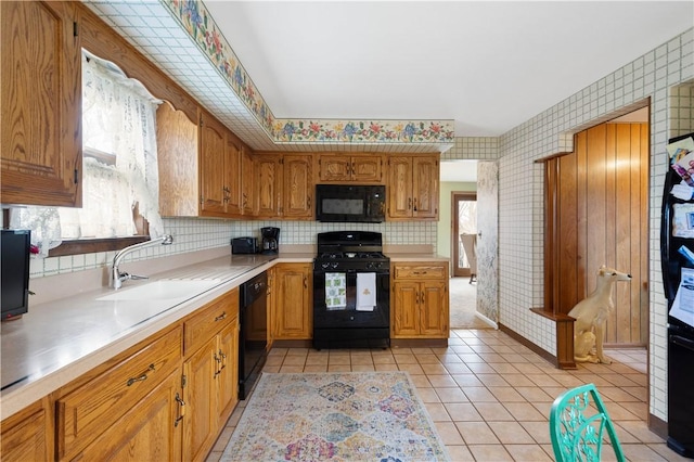 1805 Educational Dr, White Oak, PA 15131 - kitchen featuring wallpapered walls, a sink, black appliances, and plenty of natural light