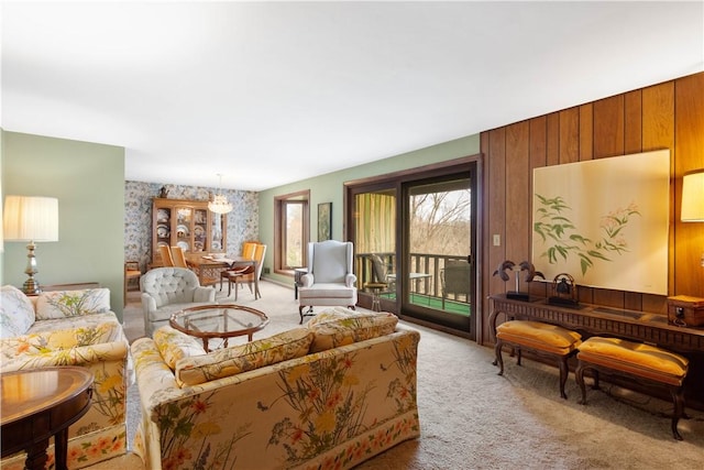 1805 Educational Dr, White Oak, PA 15131 - living room featuring a chandelier, wallpapered walls, an accent wall, and carpet